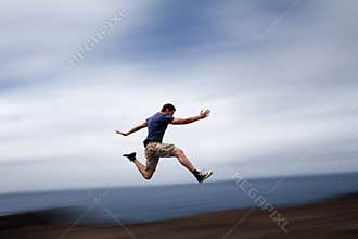 Sport and energy concept - man running fast