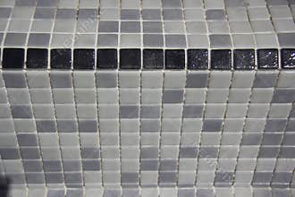 Black Stair edging tiles applied to refurbished swimming pool.