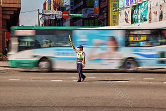 Traffic Warden Directs Moving Morning Peak Hour Traffic in Tapei