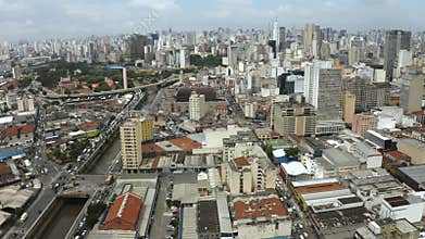 Big city life, traffic, buildings, and industries.
