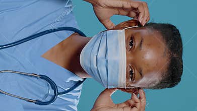 Close up of african american nurse smiling at camera