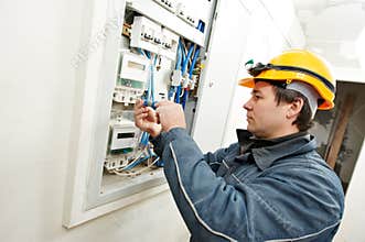 Electrician installing energy saving meter