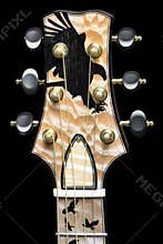 Amazing example of woodworking artistry - ebony bird inlay on flamed maple guitar headstock