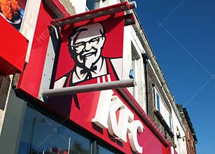 Kfc sign and logo above a high street restaurant and takeaway in Fleetwood