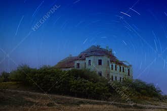 Abandoned mansion under the stars