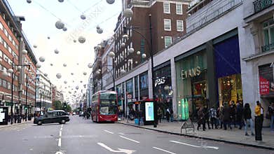 People, taxis and red double decker London buses, Oxford street, London, England