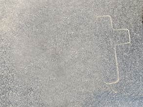 The outline of a cross on marble
