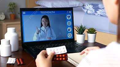 Deaf mute patient use remote distance video conference, make online consultation by sign language with doctor on laptop