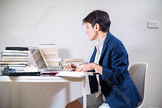 Young woman is working remotely at home