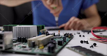 Electronics repair and maintenance service. technician working with computer parts in office