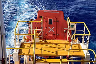 Free fall boat on a cargo ship.