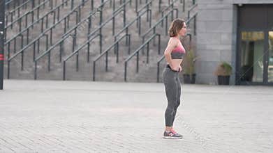 Slim fit adult woman exercise on an outdoor workout training alone. Summer sunset morning portraits in action on a european