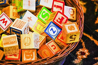 Basket of Children`s Toy Alphabet Blocks
