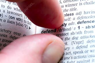 Fingers with defend text