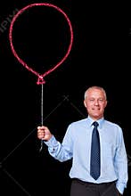Businessman holding a chalk balloon