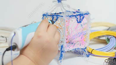 3D pen in a child's hand.