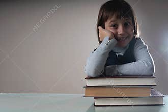 Happy young beautiful child girl with books. Free copy space