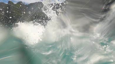 Man jumping from boat in ocean water