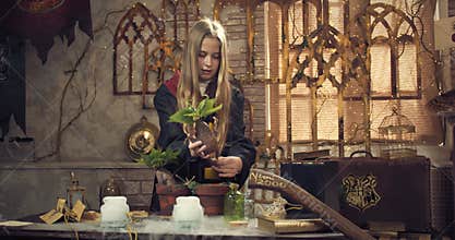 Young Hogwarts student is learning at the botany class, fantasy movie, 4k