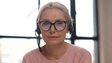 A middle-aged woman in the home office