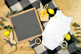 Easter farmhouse theme baby apparel top view flatlay. Mock up.