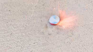 4K Shot of lighting a spinning firecracker