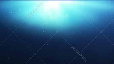 Upper View of A Big Humpback whale is swimming beneath the surface of the water with sunlight rays.
