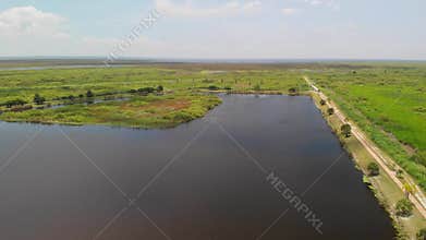 Pond and a country road near lake Okeechobee