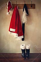 Santa costume with boots on coatrack