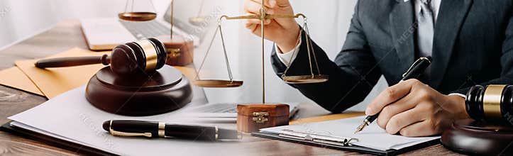 Men lawyer working with contract papers and wooden gavel on tabel in courtroom. justice and law ,attorney, court judge, concept.