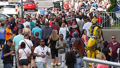 LAS VEGAS, NEVADA USA - 7 MAR 2020: People on pedestrian walkway. Multicultural men and women walking on city promenade