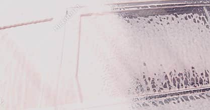 Close up video of washing car surface at auto service, car wash and detailing concept