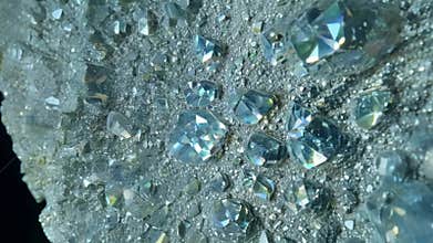 Rough pyrite mineral specimen sparkling on dark background