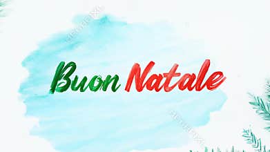 \"Buon Natale\" message in green and red cursive text with a soft sky background. VIDEO