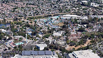 California\'s Great America aerial view with roller coasters, water rides, and surrounding urban area