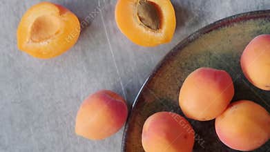 ripe apricots on a round plate
