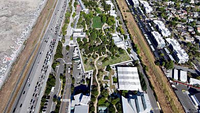 Meta MPK Building 21 aerial view with rooftop garden, adjacent highway