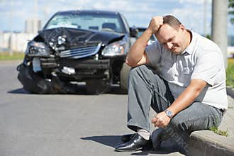 Upset man after car crash