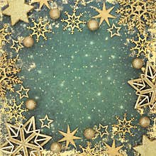 Christmas Gold Star Bulb Snowflake Decorations on Fantasy Green Background