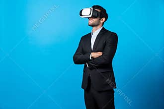 Smart business man crossing arms and standing at white background. Deviation.