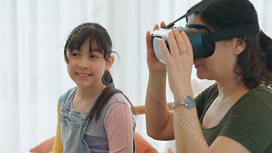 Granddaughter guide grandmother to dive in metaverse with VR. Divergence.