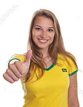 Smiling brazilian soccer supporter showing thump up