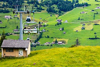 A cable railway and panorama view of mountain landscape in Switzerland.