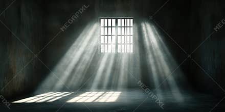 Light rays streaming through barred window in dim room