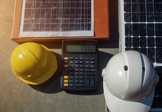 Engineers calculating costs of solar panel installation project