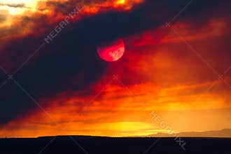 Sun obscured by wildfire smoke