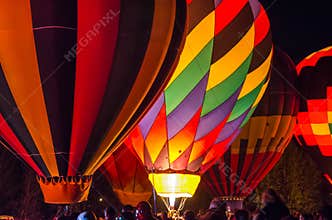 Bright Hot Air Balloons Glowing at Night