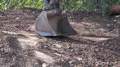 Excavator bucket in operation. Excavation works