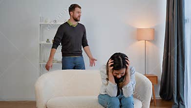 Domestic violence and abuse concept. Abusive husband arguing wife, jealous distrustful dominant man shouting at sad