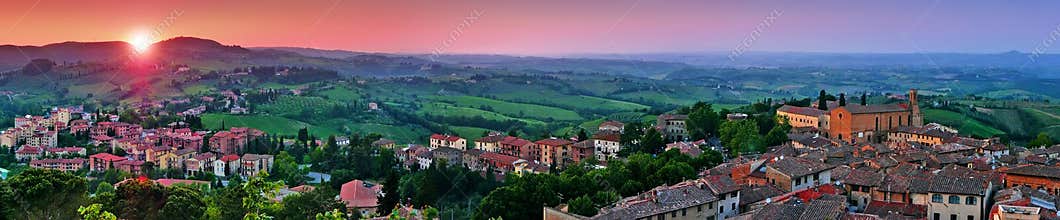 Panoramic view of beautiful landscape with the medieval city of San Gimignano at sunset in Tuscany, province of Siena, Italy